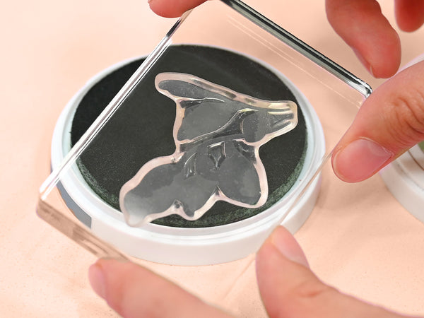 Tap your chosen ink color on a stamp